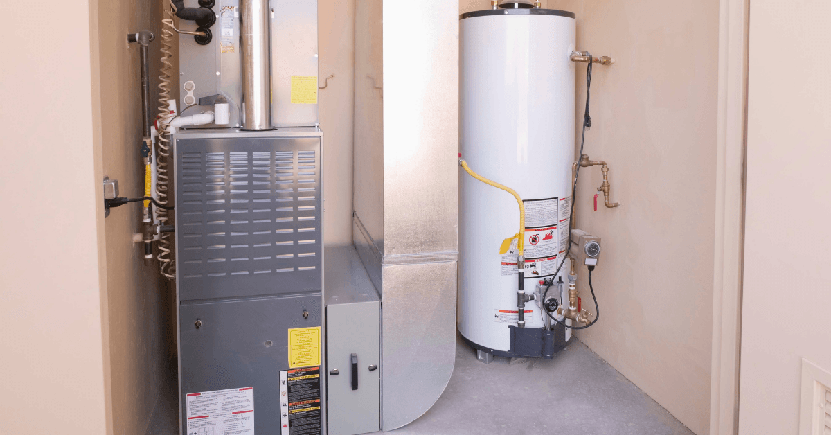 A room with a heater and a water heater in it.