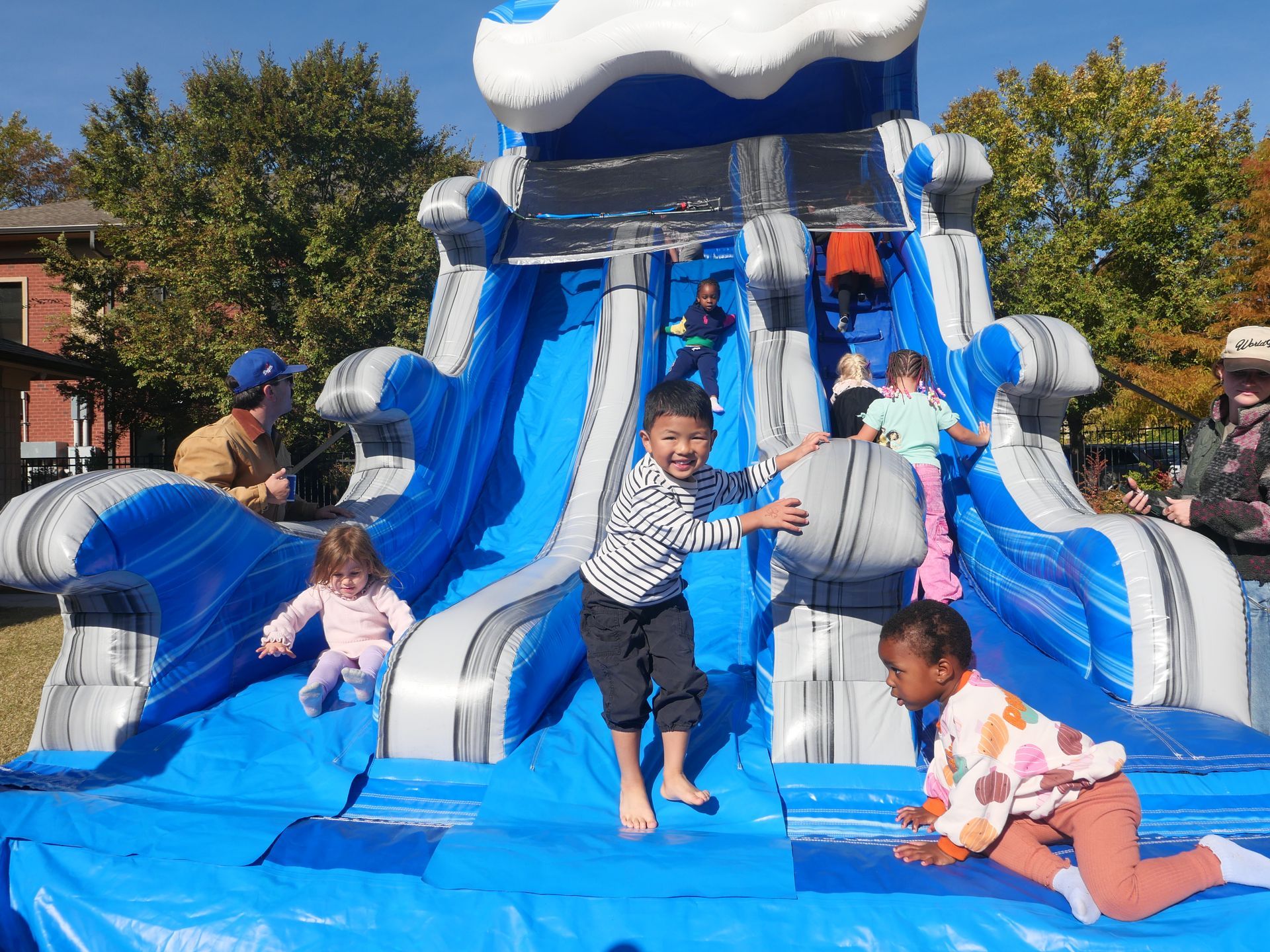 Montessori child in fall festival jump