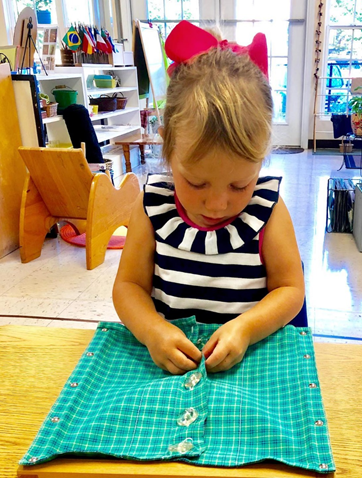 Child working with Montessori language materials