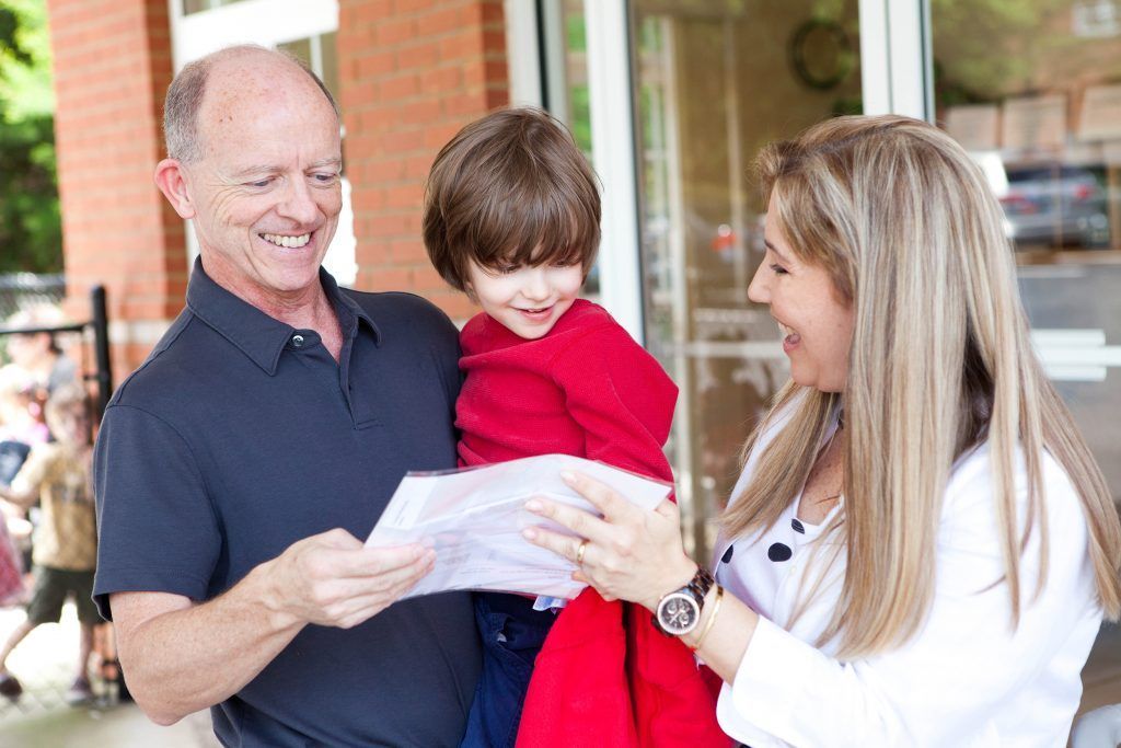 Montessori parents with their child