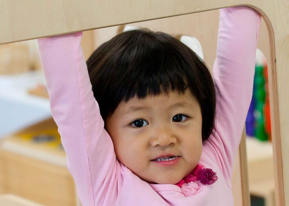 Montessori child looking at the camera
