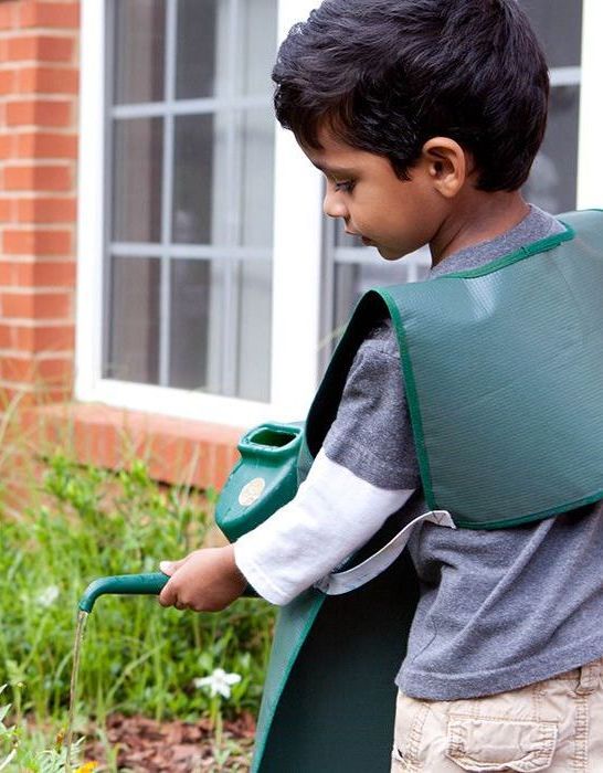Montessori child watering the school garden