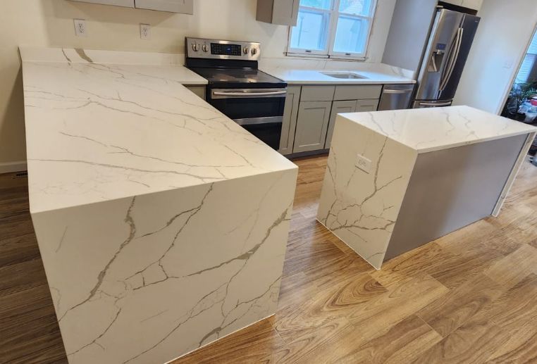 Newly renovated kitchen featuring quartz countertops, cabinets, and appliances.