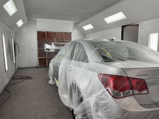 Automotive Painting in Paint Booth at Dick's Body Shop in Tecumseh, MI