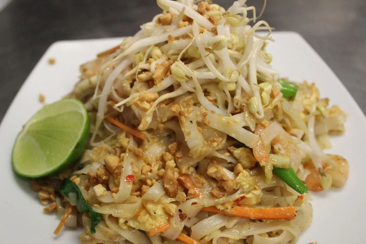 Pad Thai Noodles with Bean Sprouts, Peanuts, Lime on A White Plate — L'il Buddha Asian Cuisine in Salamander Bay, NSW
