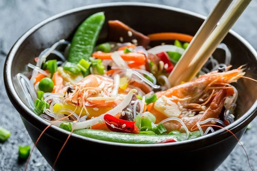 Bowl of Asian Noodles With Shrimp and Vegetables. Chopsticks — L'il Buddha Asian Cuisine in Salamander Bay, NSW