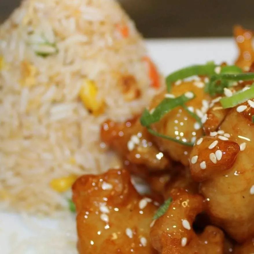 Fried Rice and Orange Glazed Chicken Topped with Sesame Seeds — L'il Buddha Asian Cuisine in Salamander Bay, NSW