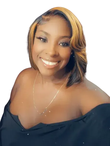 A woman wearing a black off the shoulder top and a gold necklace is smiling.