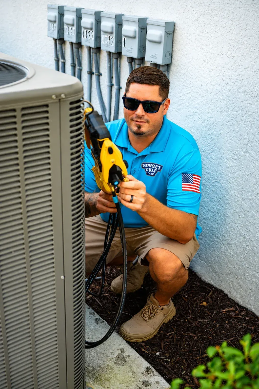 Sunset Gulf HVAC technician working on an outdoor condensing unit during a same-day service call in Southwest Florida.