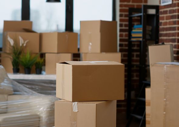 Stacked of moving boxes in a room