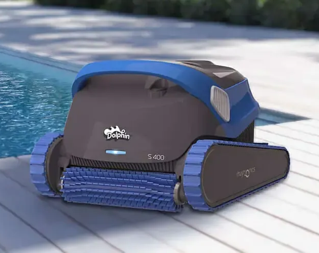 Dolphin S400 robotic pool cleaner; dark gray, blue, on a deck beside a pool.