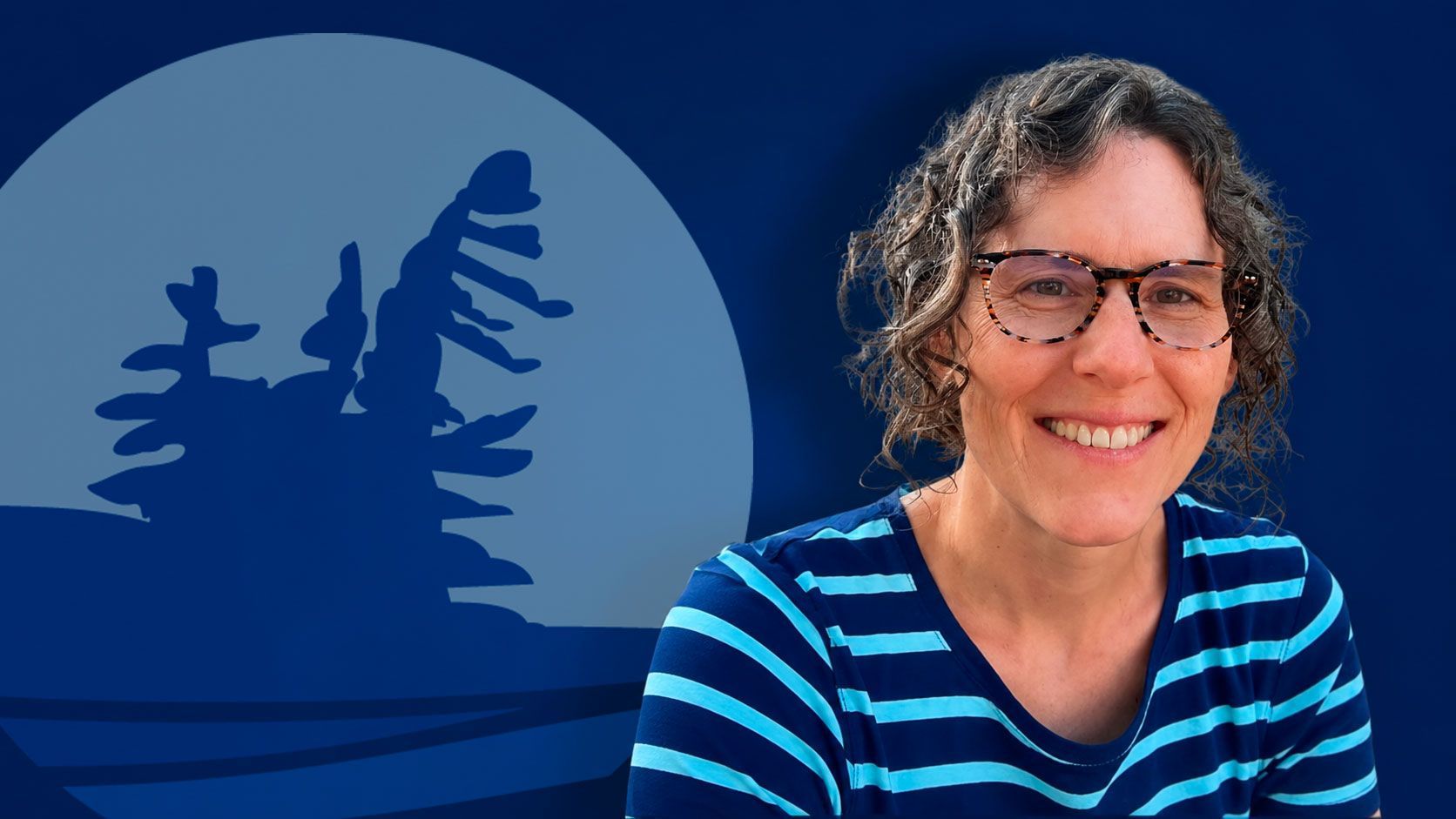 Smiling person in glasses and striped shirt before a blue background with a moon and tree silhouette