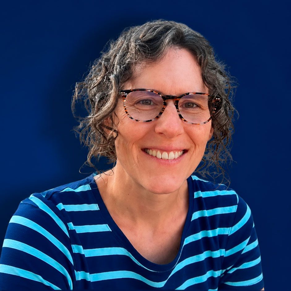 Smiling woman in glasses and striped shirt beside a blue graphic of trees and a moon