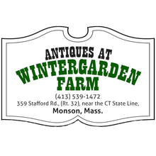 Antiques at Wintergarden Farm sign with green lettering and Monson, Mass. address