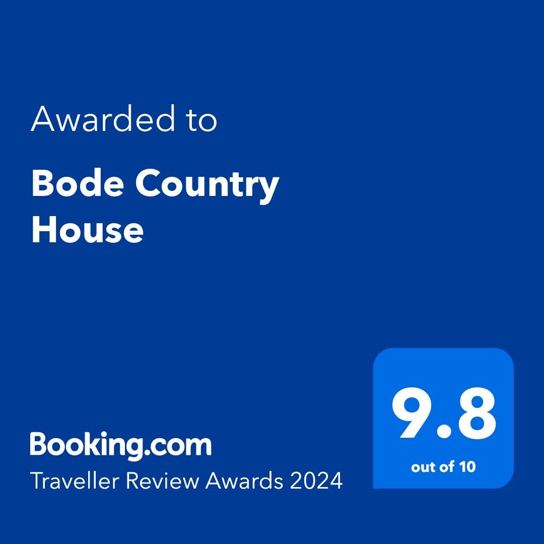 Booking.com Traveller Review Award for Bode Country House, score 9.8 out of 10, blue background.