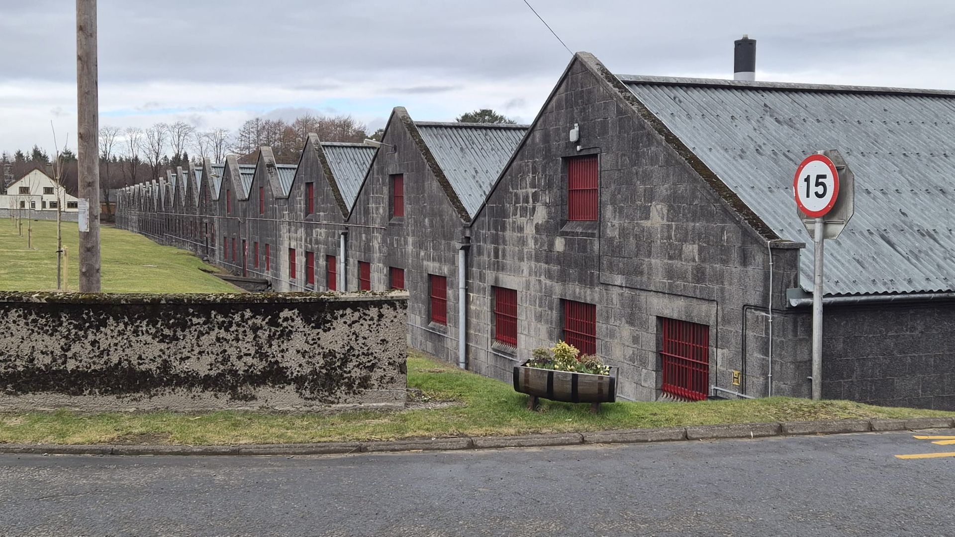 The bonded warehouse of the Ardmore Distillery includes many conjoined buildings with apex rooves.