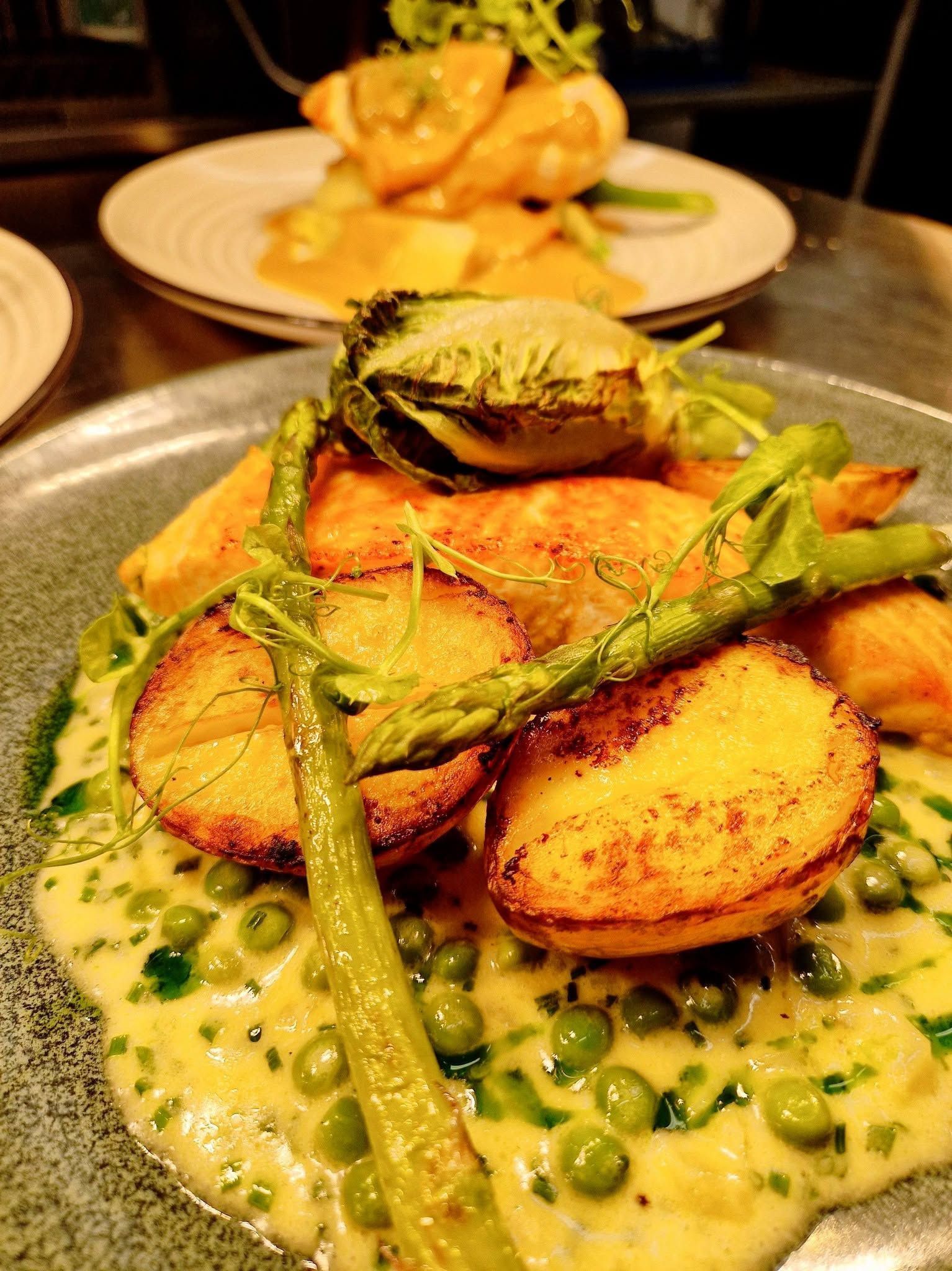 Seared salmon with asparagus, peas and grilled lettuce