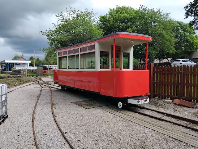 Red Aberdeen City tram car parked up on the rails