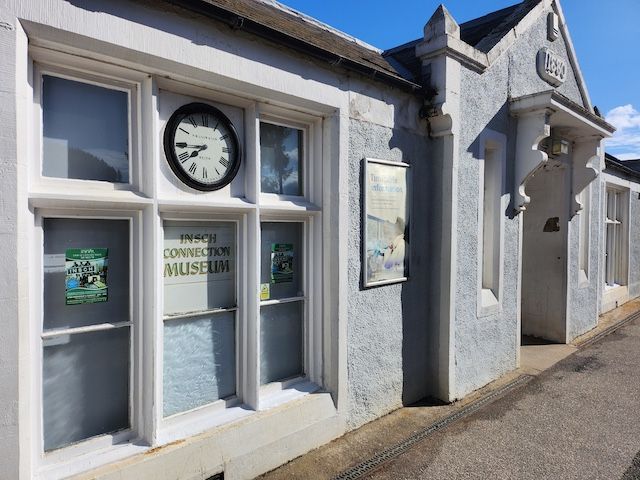 An external view of the old station in Insch, now the Insch Connection Museum, painted in grey.