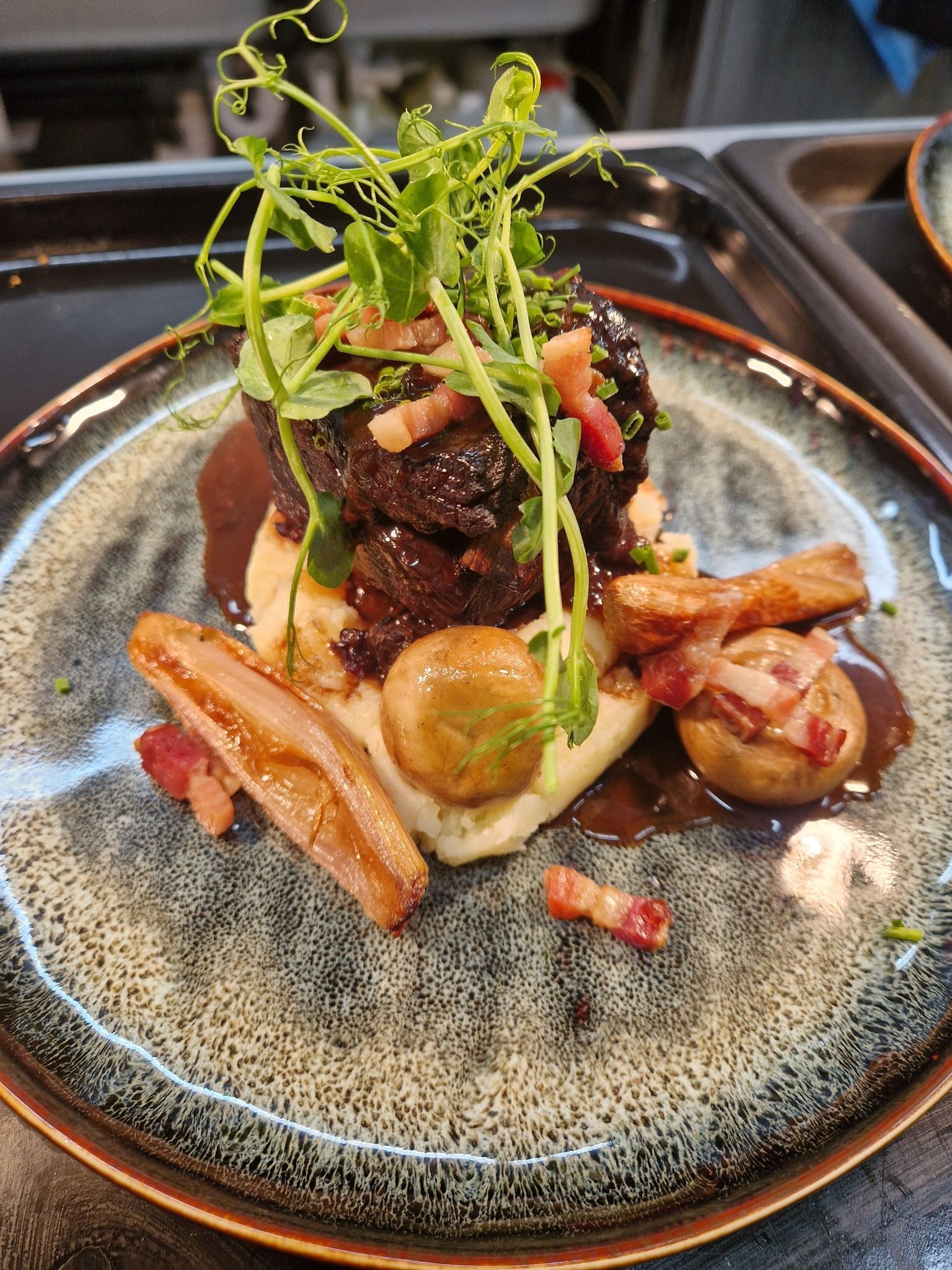 A main course from the chef at The Station Hotel including Stornoway Black Pudding, decorated with pea shoots.