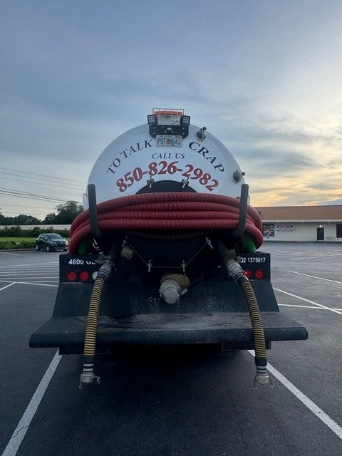 Rear view of a septic tank truck with