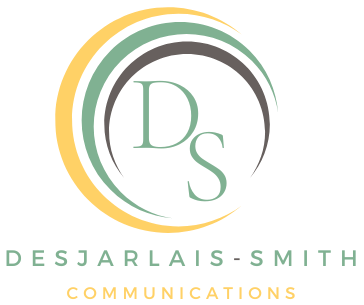 Desjarlais-Smith Communications logo with green initials, gold and gray circular accents on white background