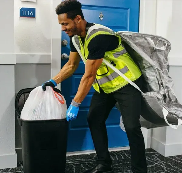 Walker Trash Solutions team providing doorstep trash pickup