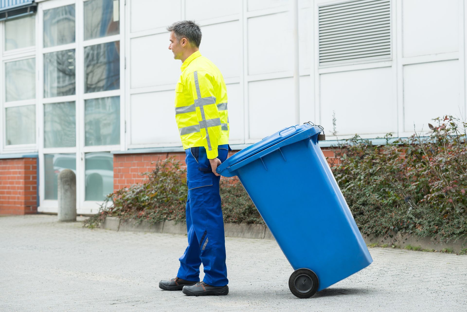 Walker Trash Solutions team providing doorstep trash pickup