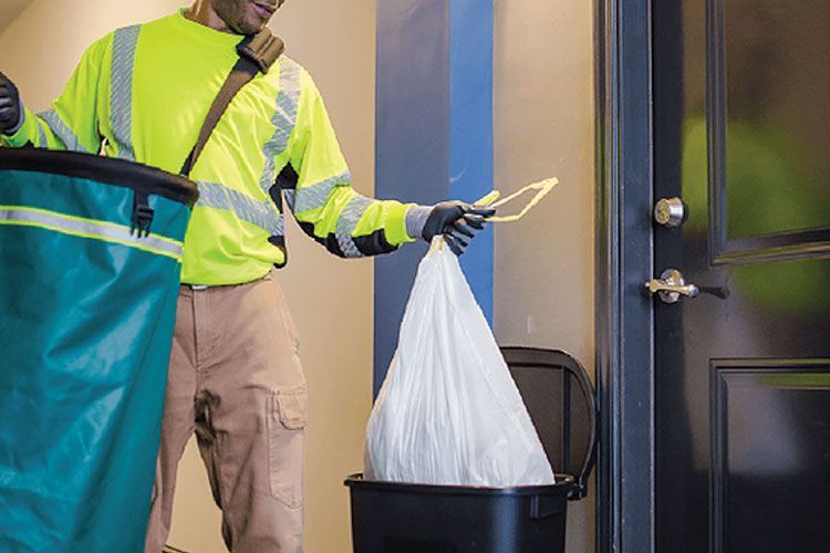 Walker Trash Solutions team providing doorstep trash pickup