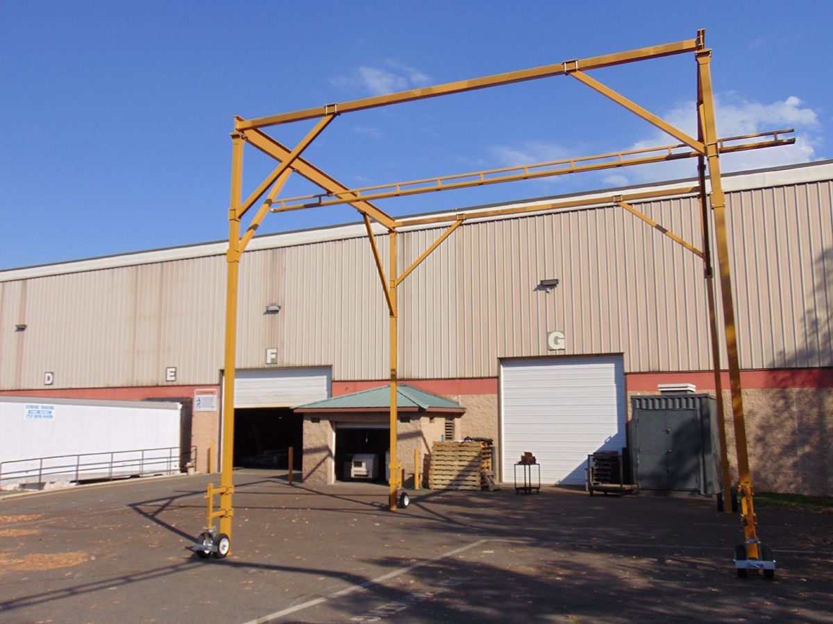 A large building with a large yellow structure in front of it