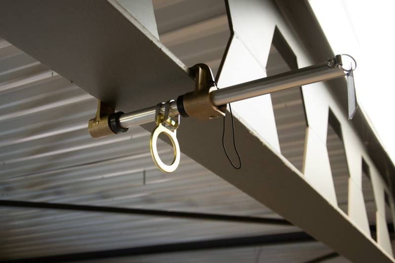 A rope is hanging from the ceiling of a building.