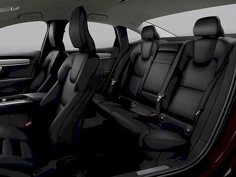 The interior of a red car with black leather seats