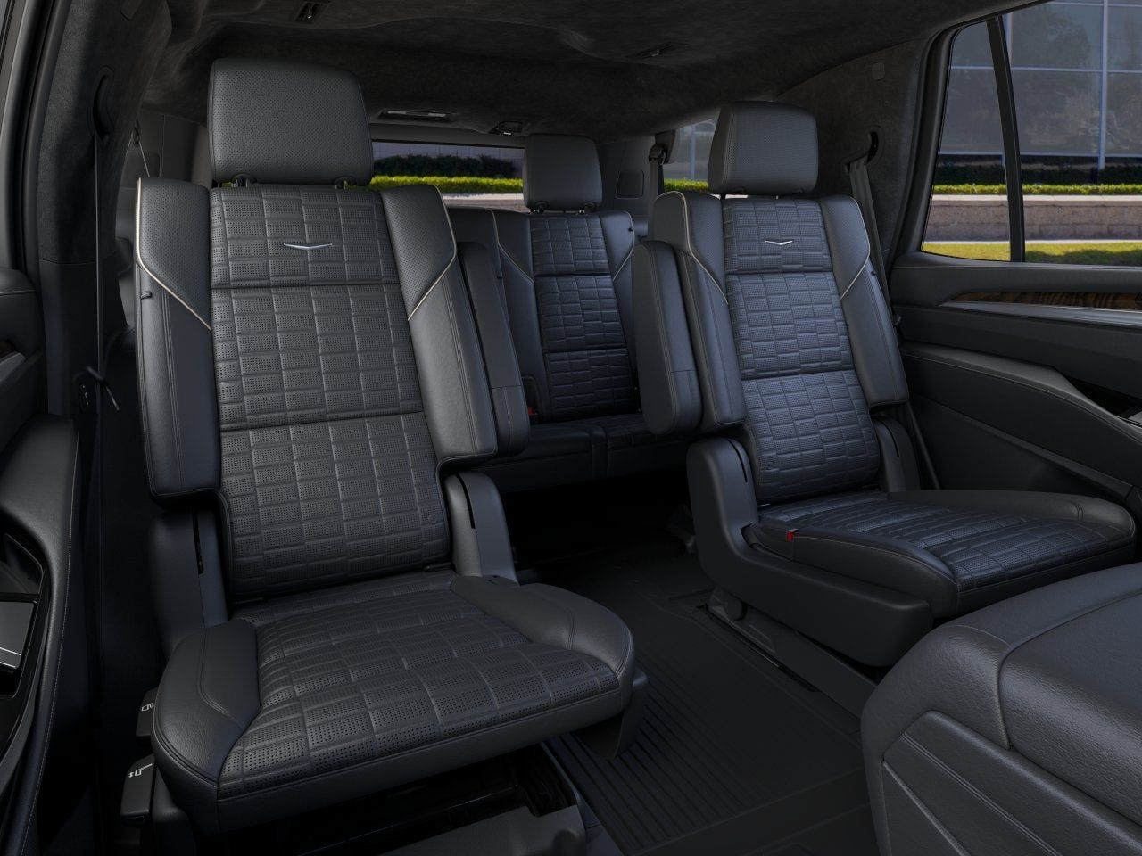 The back seat of a car with black leather seats