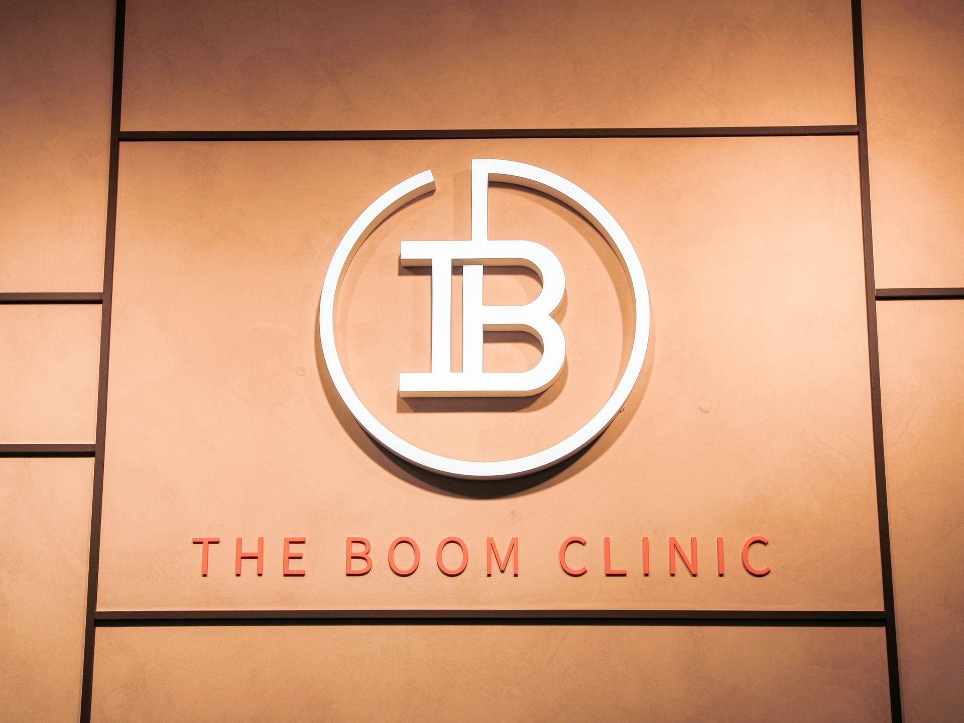 The Boom Dermatology logo wall inside the skin clinic, Busan Seomyeon