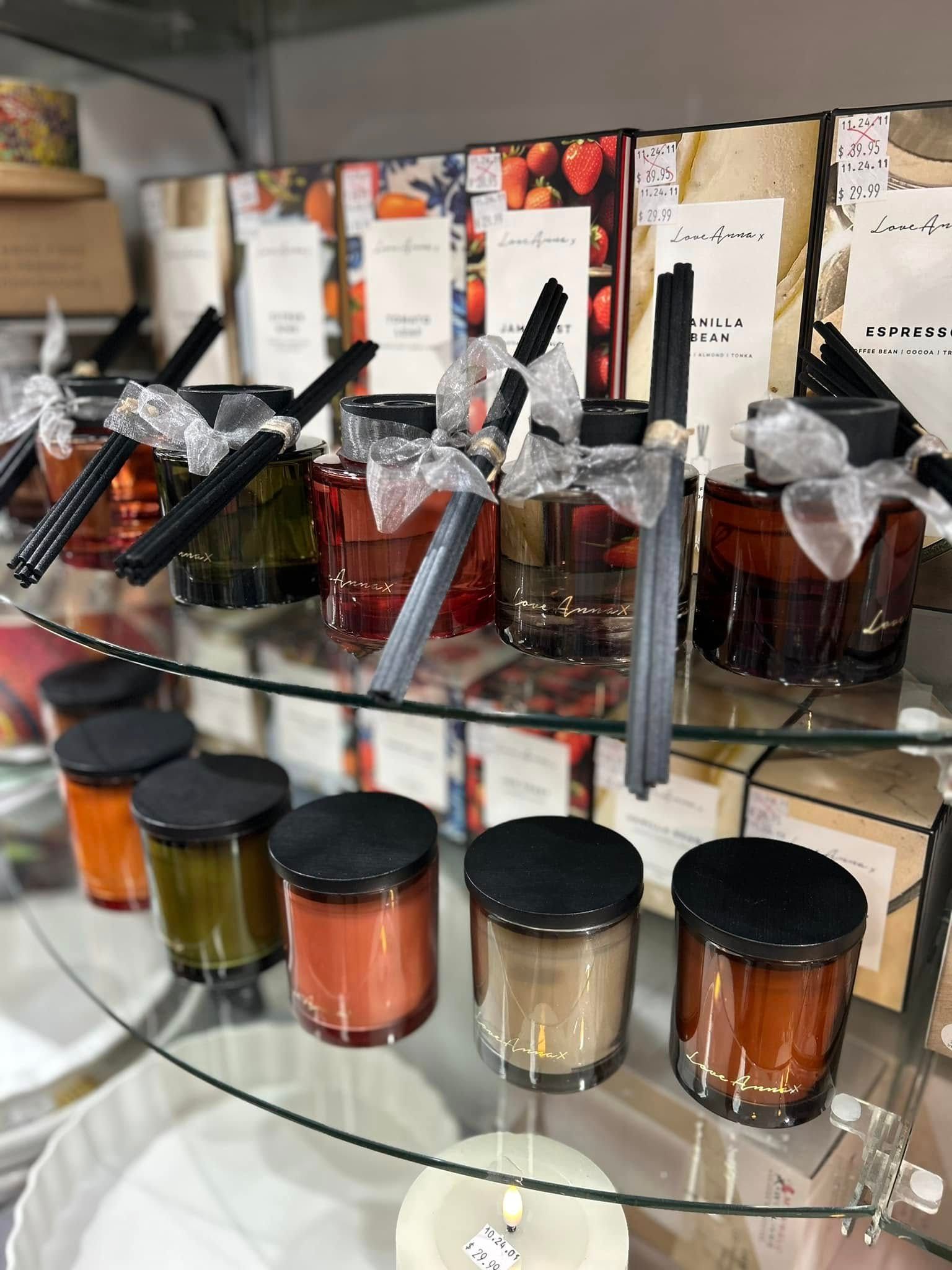 A Store Shelf Featuring Various Scented Candles and Reed Diffusers — Kitchen Bar and More In Caloundra, QLD