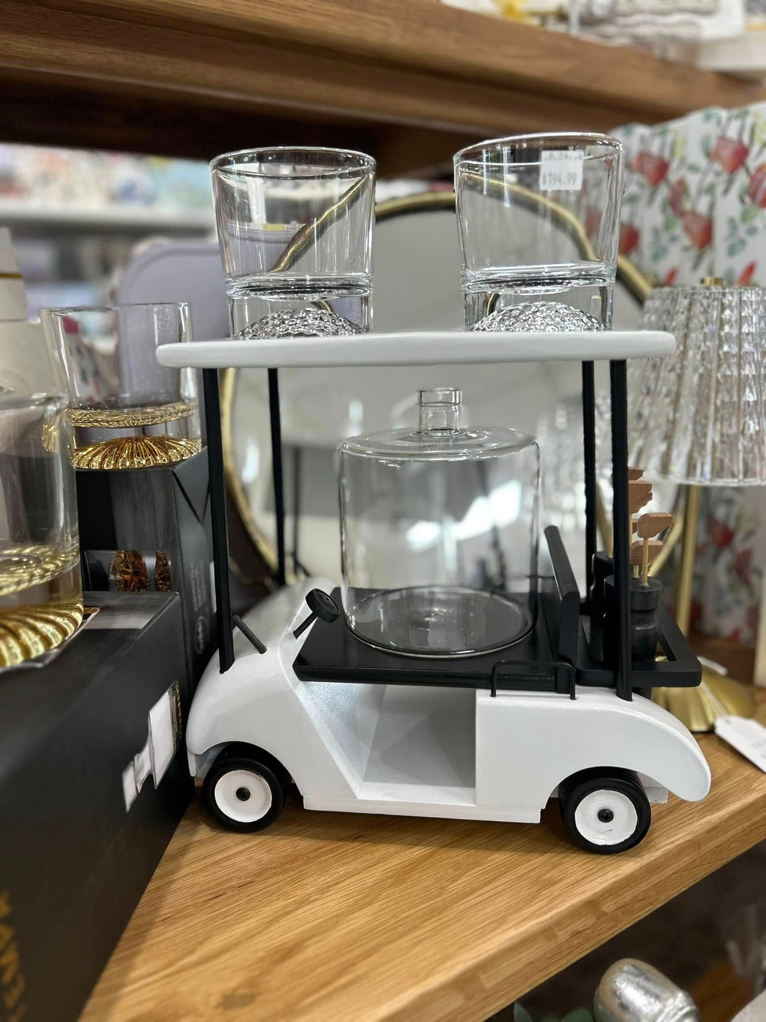 A White Golf Cart-shaped Server With a Glass Cloche on the Seat — Kitchen Bar and More In Caloundra, QLD