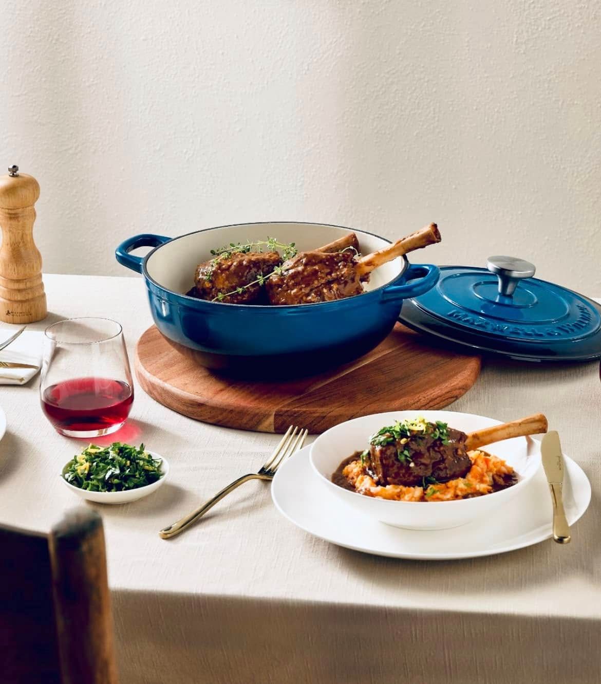 A Blue Enameled Dutch Oven Holds Braised Lamb Shanks — Kitchen Bar and More In Caloundra, QLD