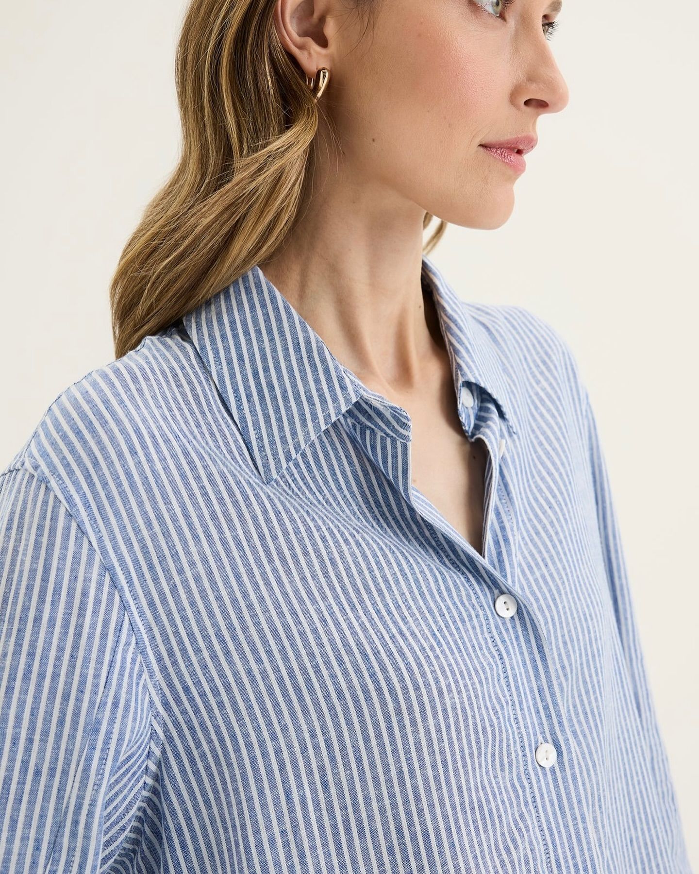 A Close-up Shot of a Person Wearing a Blue and White Pinstriped — Kitchen Bar and More In Caloundra, QLD