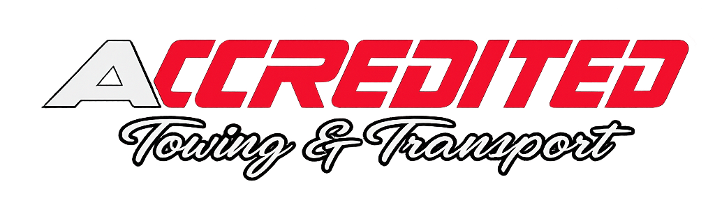 Logo for Accredited Towing & Transport; red letters, script