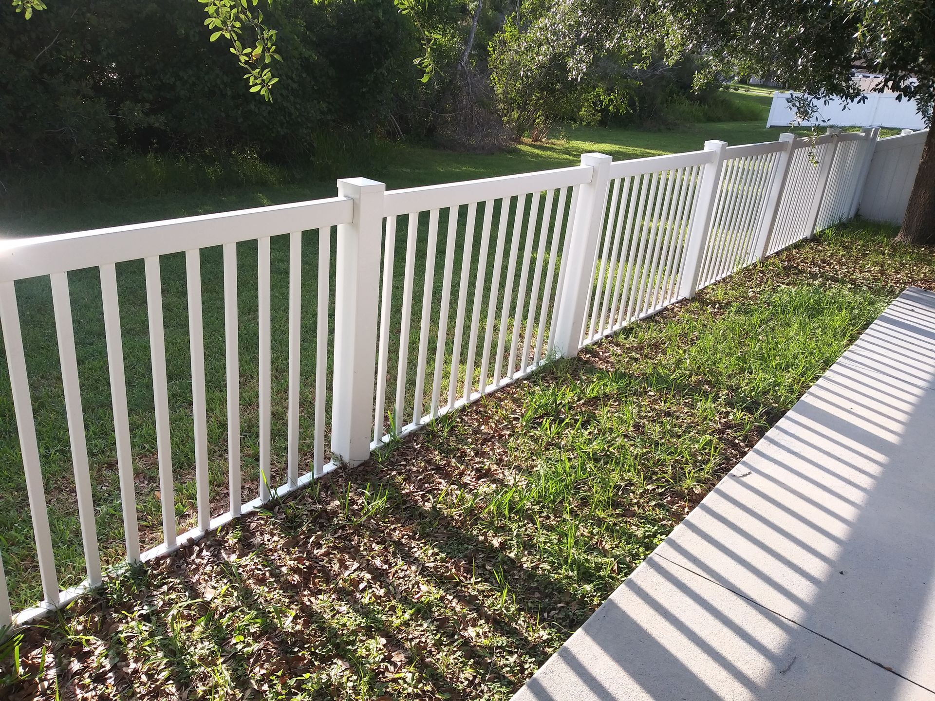 white fence pressure washing