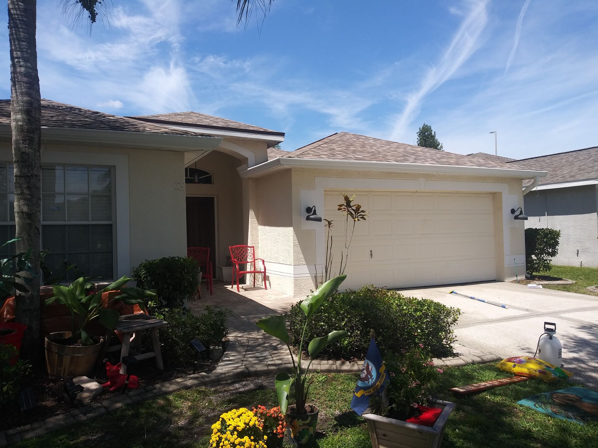 The front of a house with a white garage door