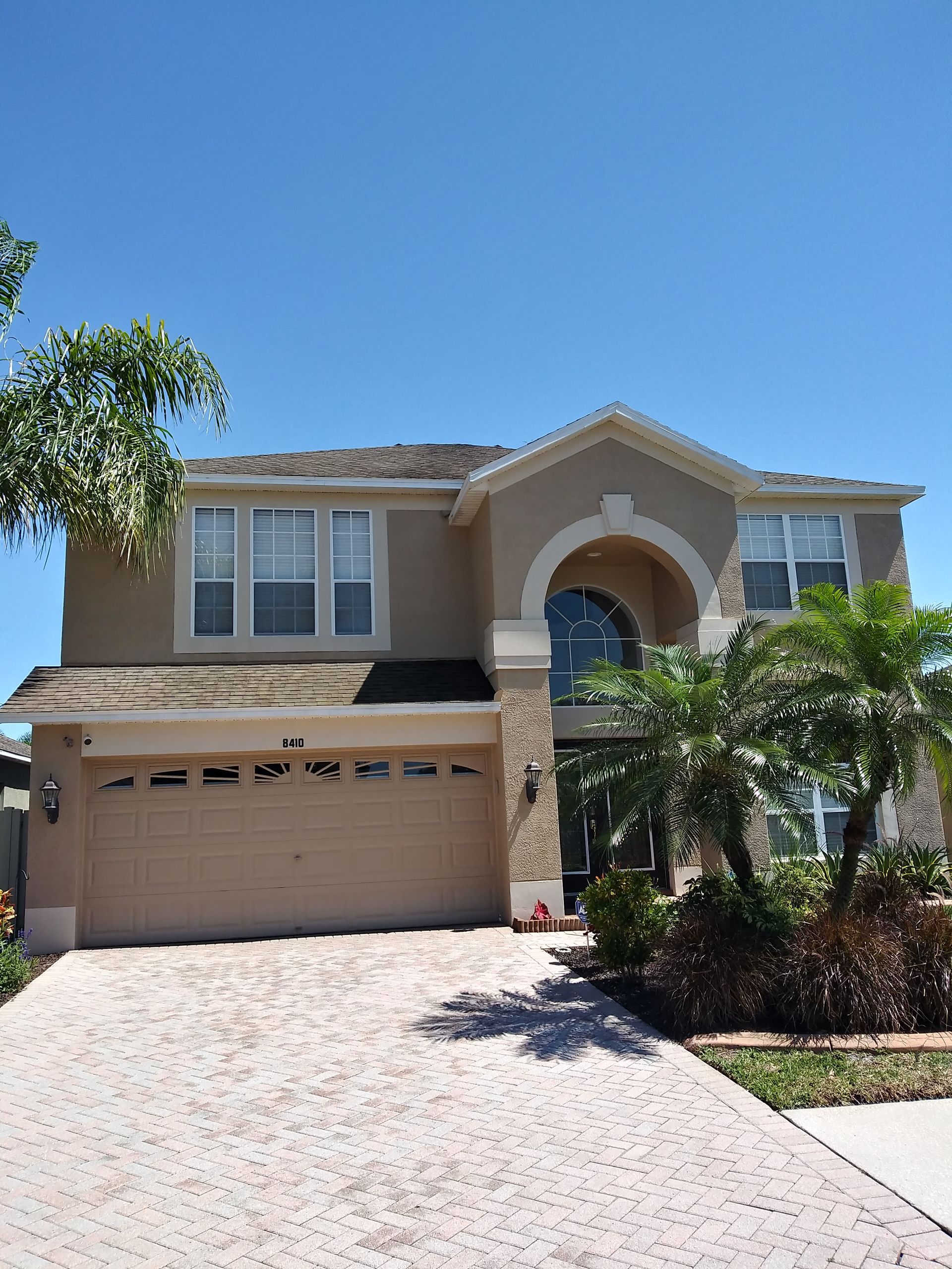 A large house with a garage and a driveway