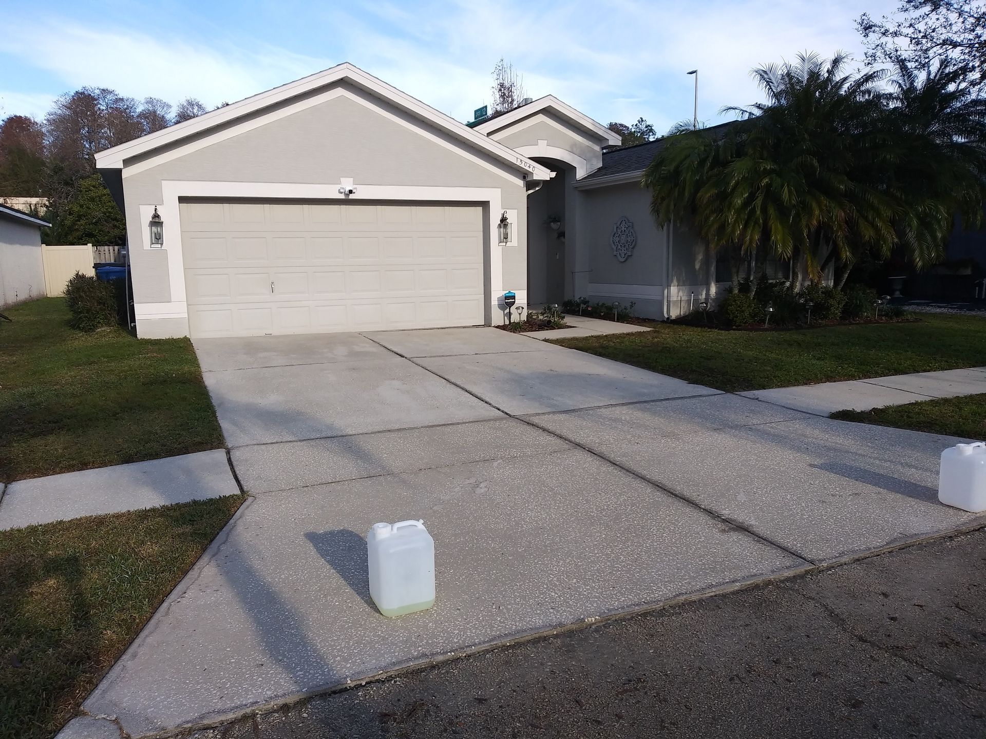 A house with a garage and a concrete driveway