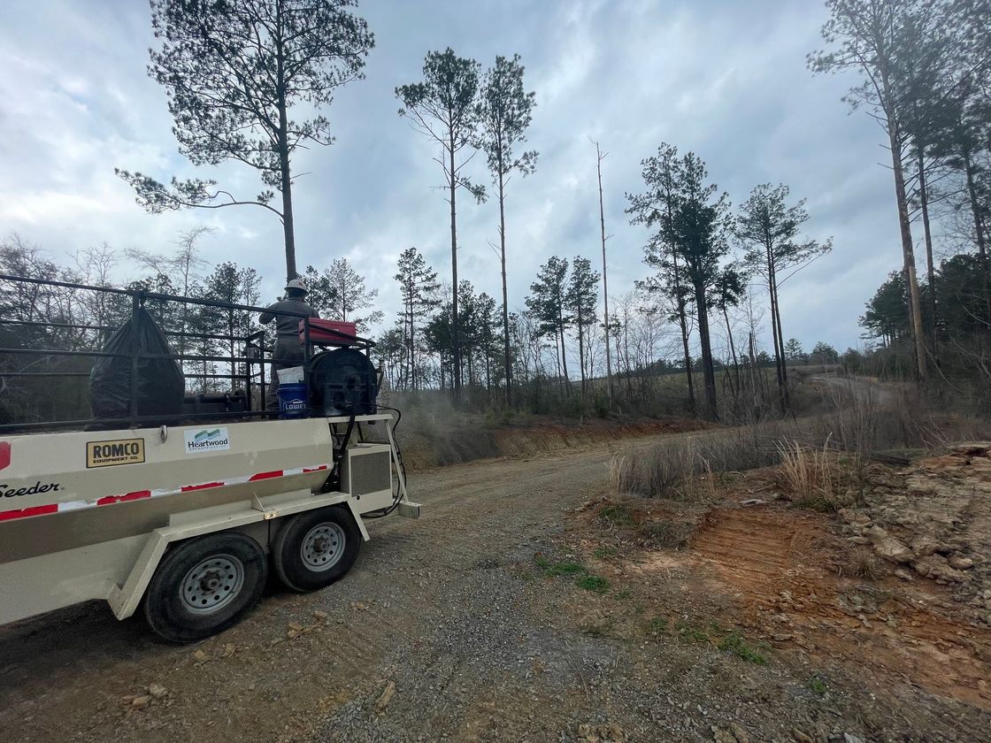 a romco trailer is parked on a dirt road
