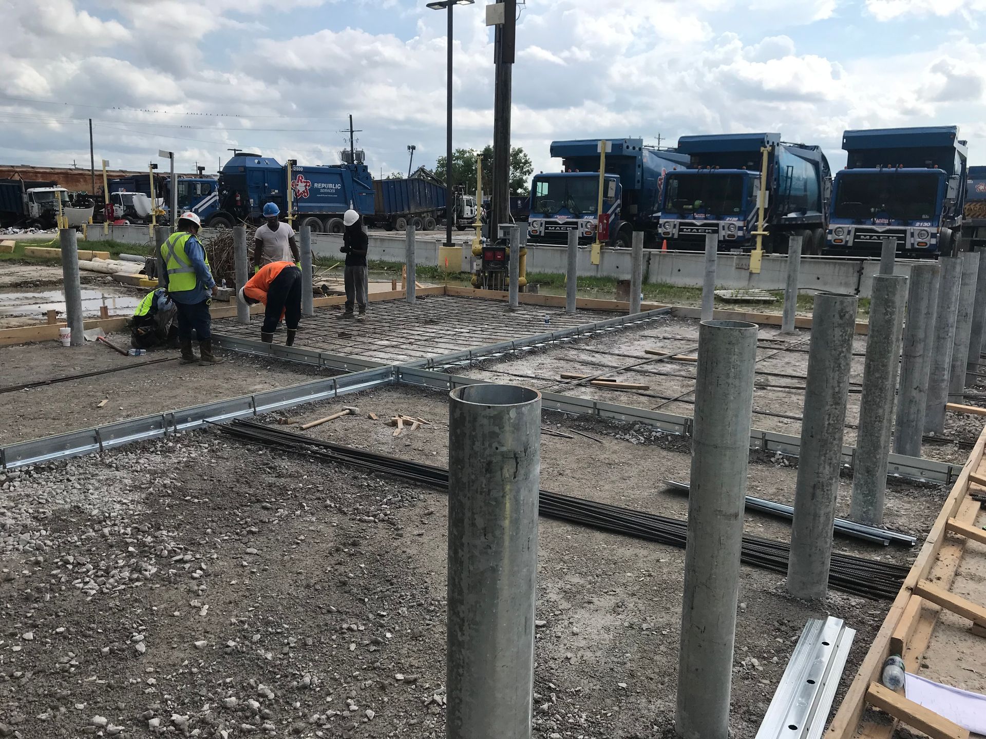 a group of construction workers are working on a construction site .