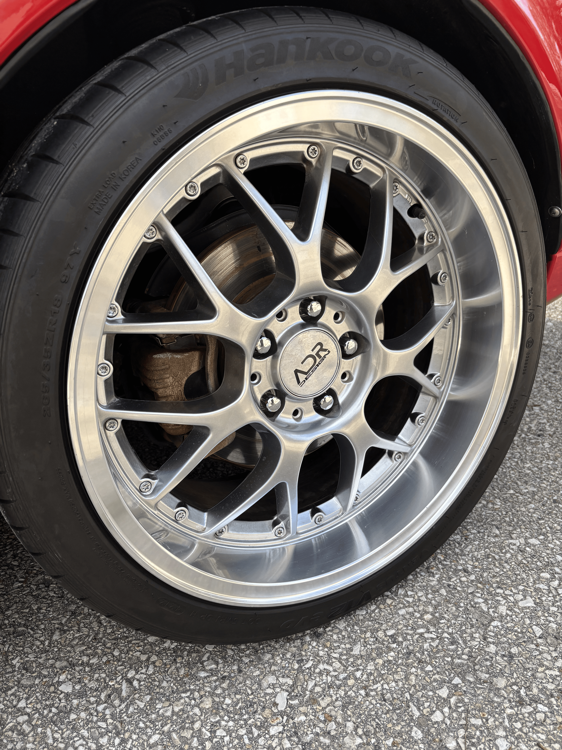 A close up of a car wheel with a tire on it