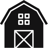 A black and white silhouette of a barn with squares on the windows.
