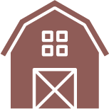 An icon of a barn with squares on the roof.