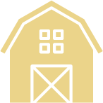 A yellow barn with a white door and windows on a white background.