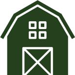 A green barn with a white door and windows on a white background.